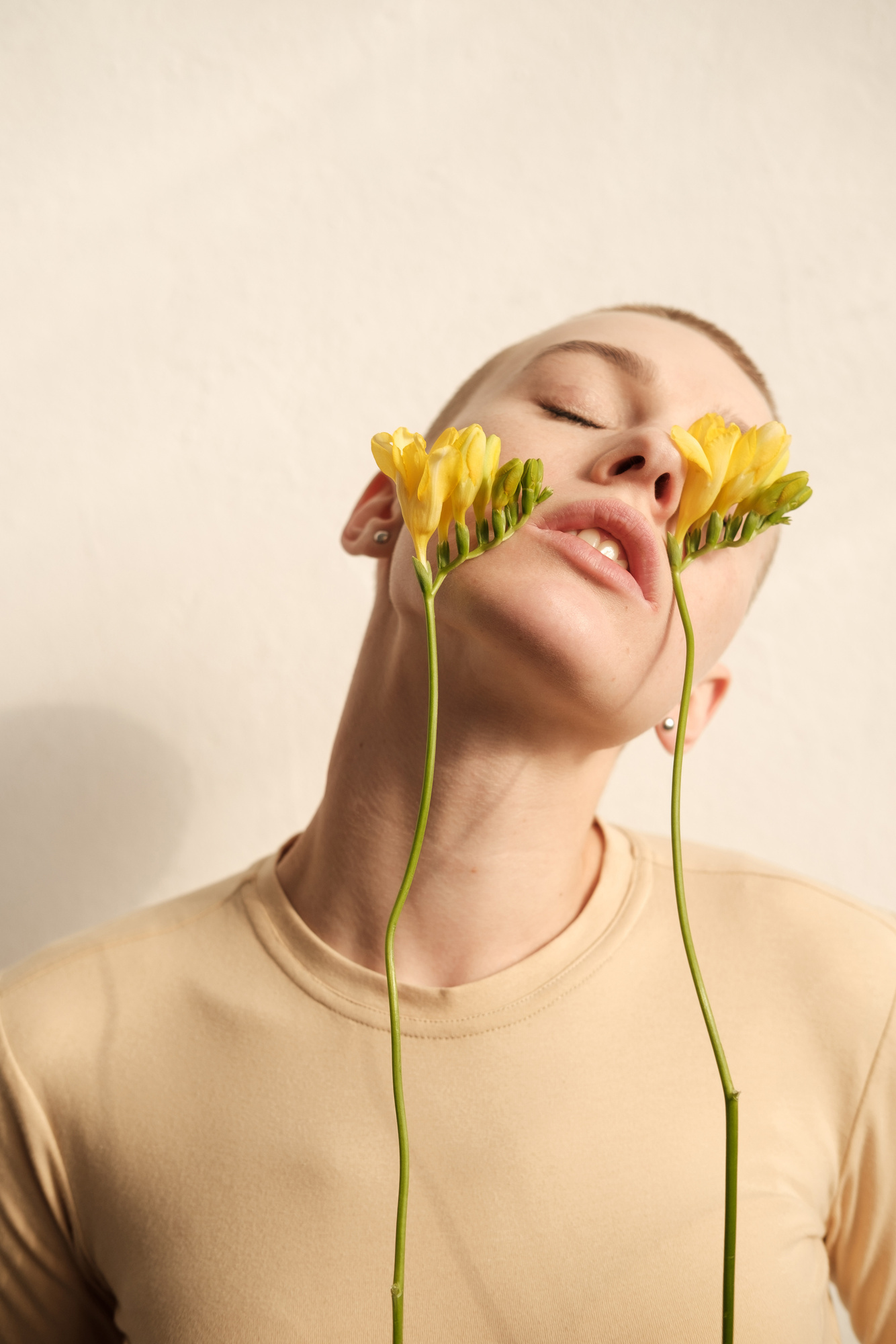Woman in Beige Shirt with Yellow Flowers on Face